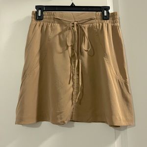 Tan tie waist mini skirt. BCBG size small. Never worn